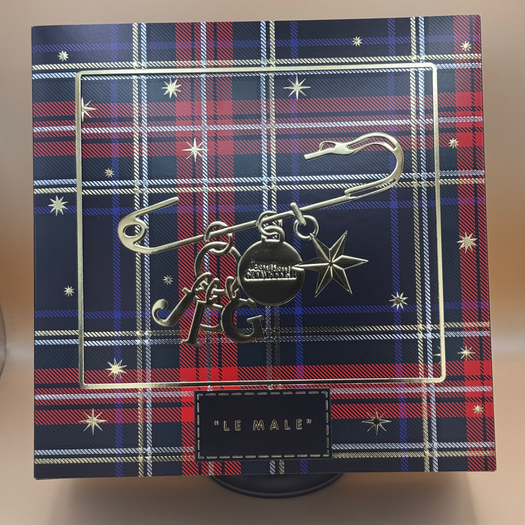 Decorative box with plaid pattern and 'Le Male' branding