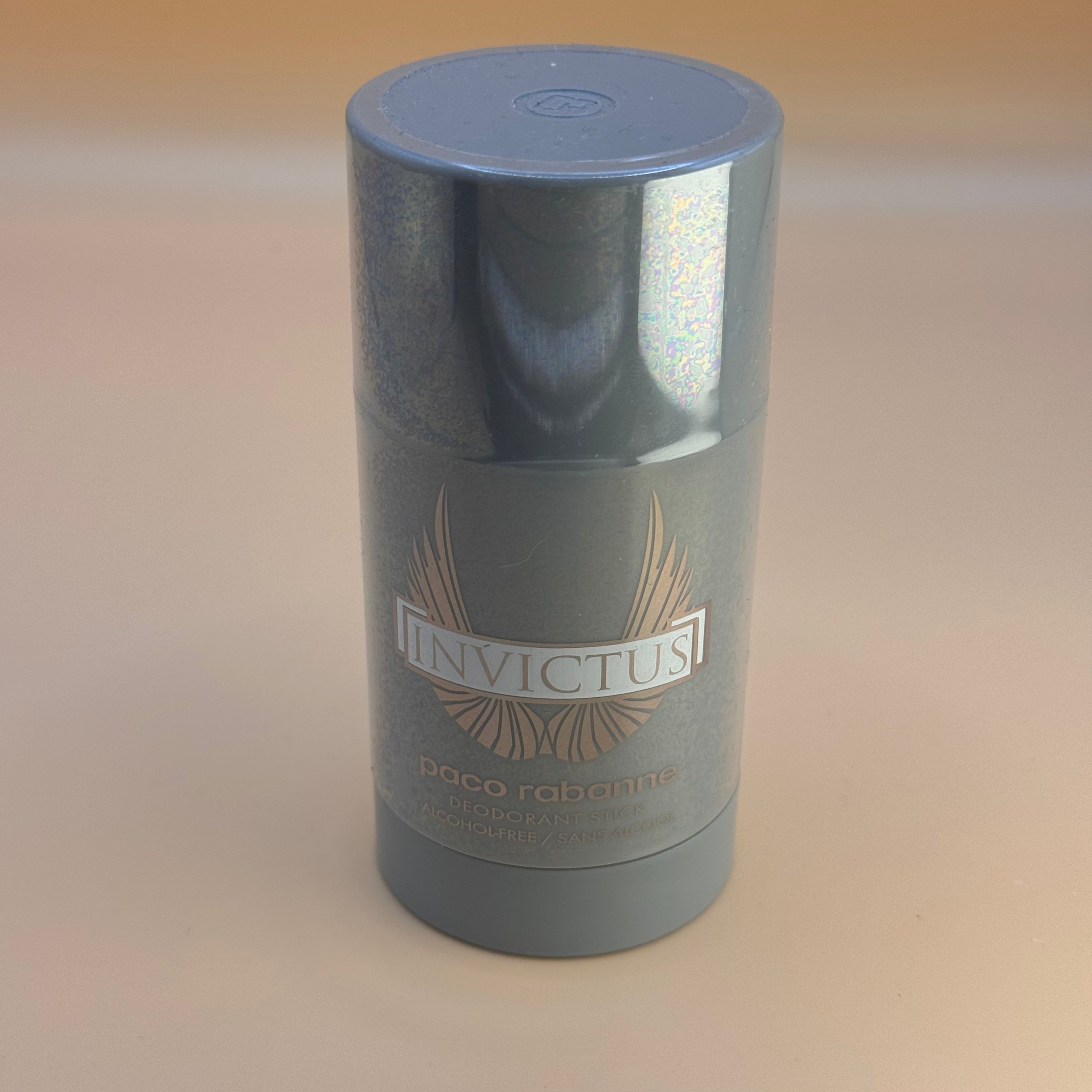Invictus deodorant stick by Paco Rabanne on a beige background