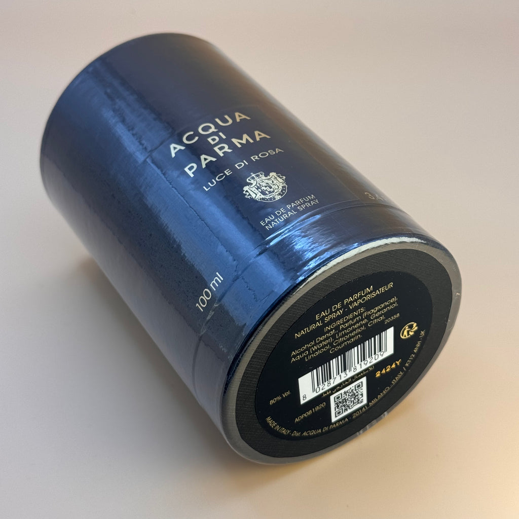 Blue Acqua di Parma Luce di Rosa perfume bottle on a light background