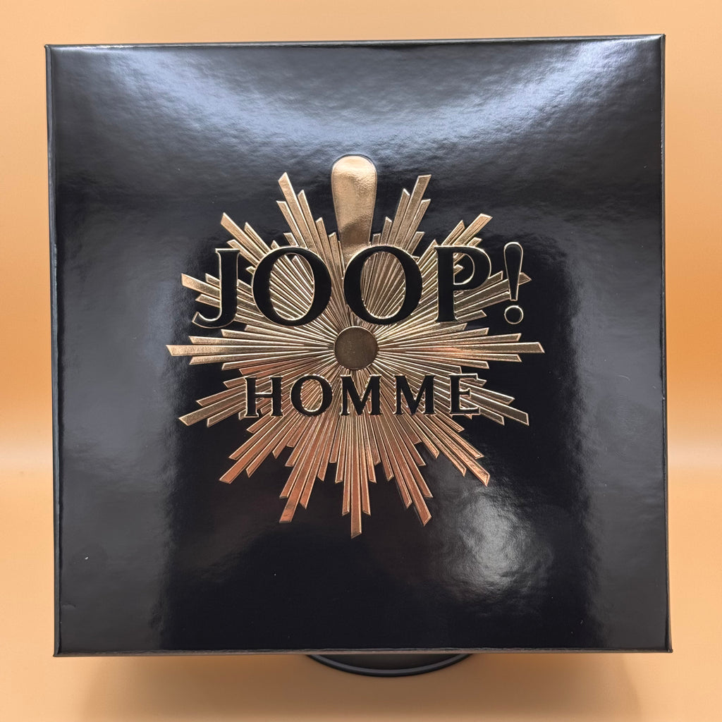 Black box with 'JOOP! HOMME' logo on a beige background