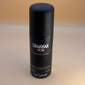 Drakkar Noir deodorant bottle on a beige background