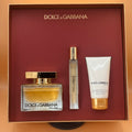 Dolce & Gabbana perfume set with a bottle, travel spray, and lotion in a branded box.