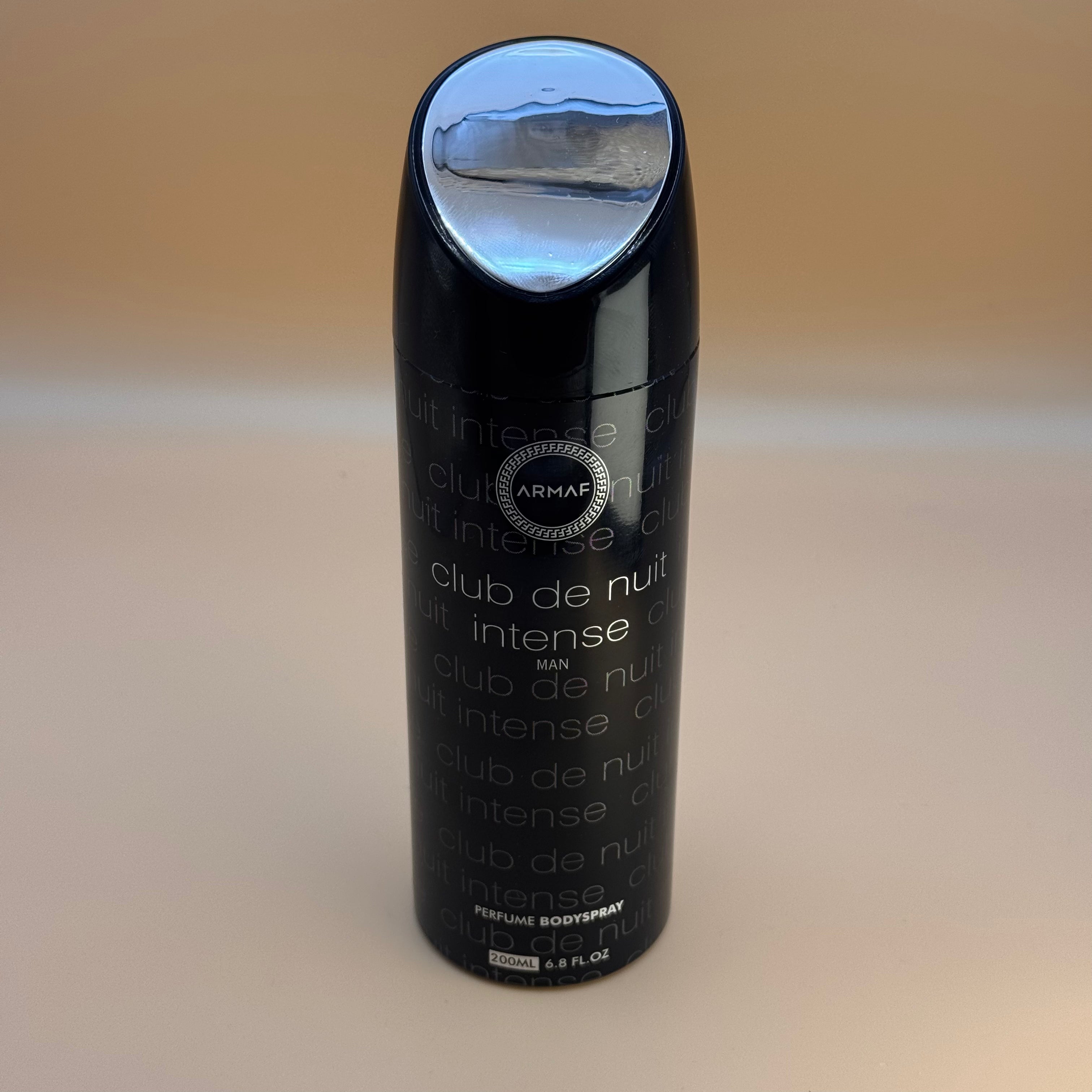 Black Armaf Club de Nuit Intense perfume bottle on a beige background
