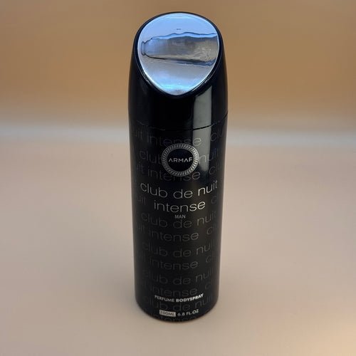 Black Armaf Club de Nuit Intense perfume bottle on a beige background