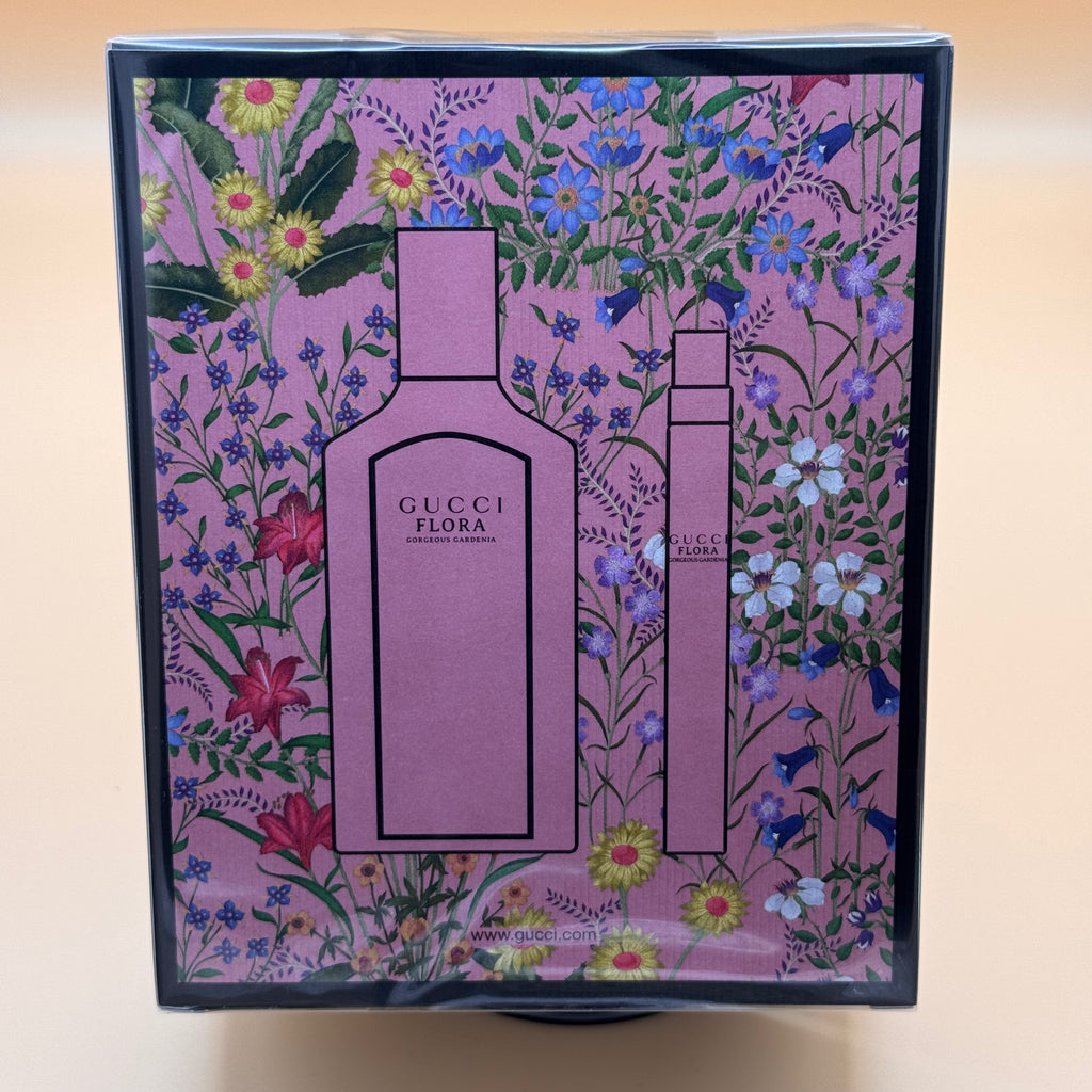 Gucci Flora perfume packaging with floral design on a beige background