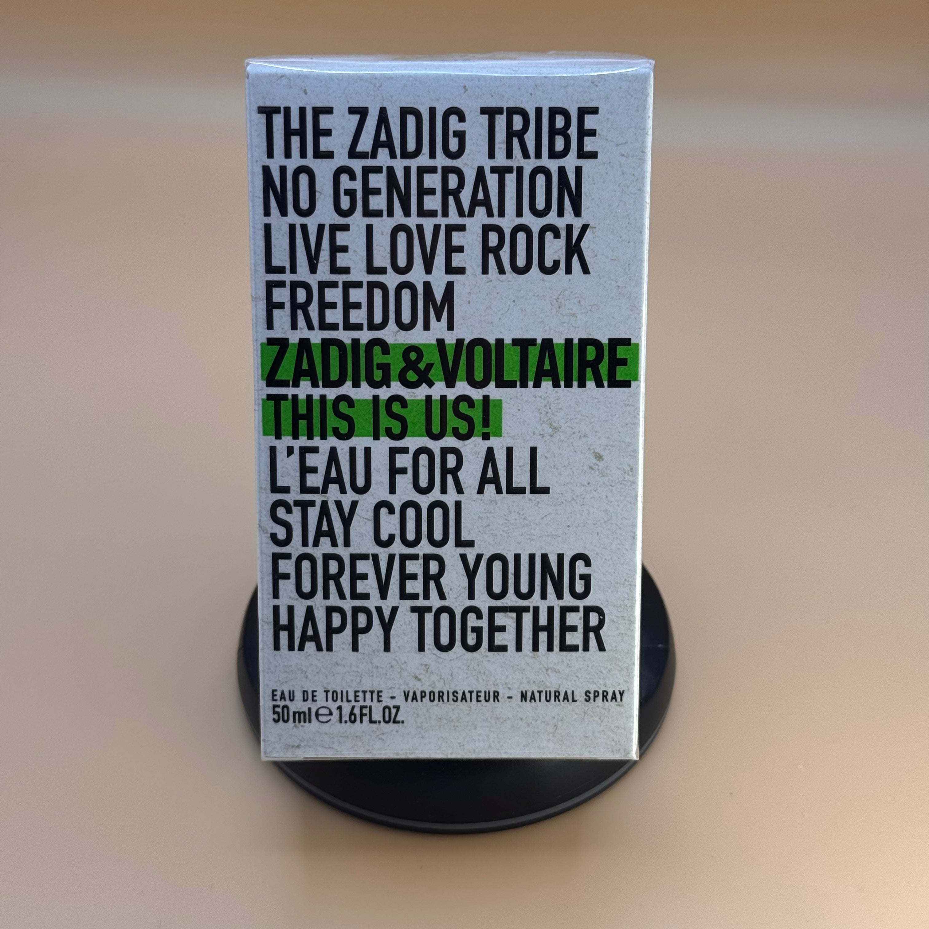 Zadig & Voltaire perfume packaging with text on a beige background