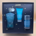 Jean Paul Gaultier perfume set with bottle, after-shave, and deodorant in a decorative box.