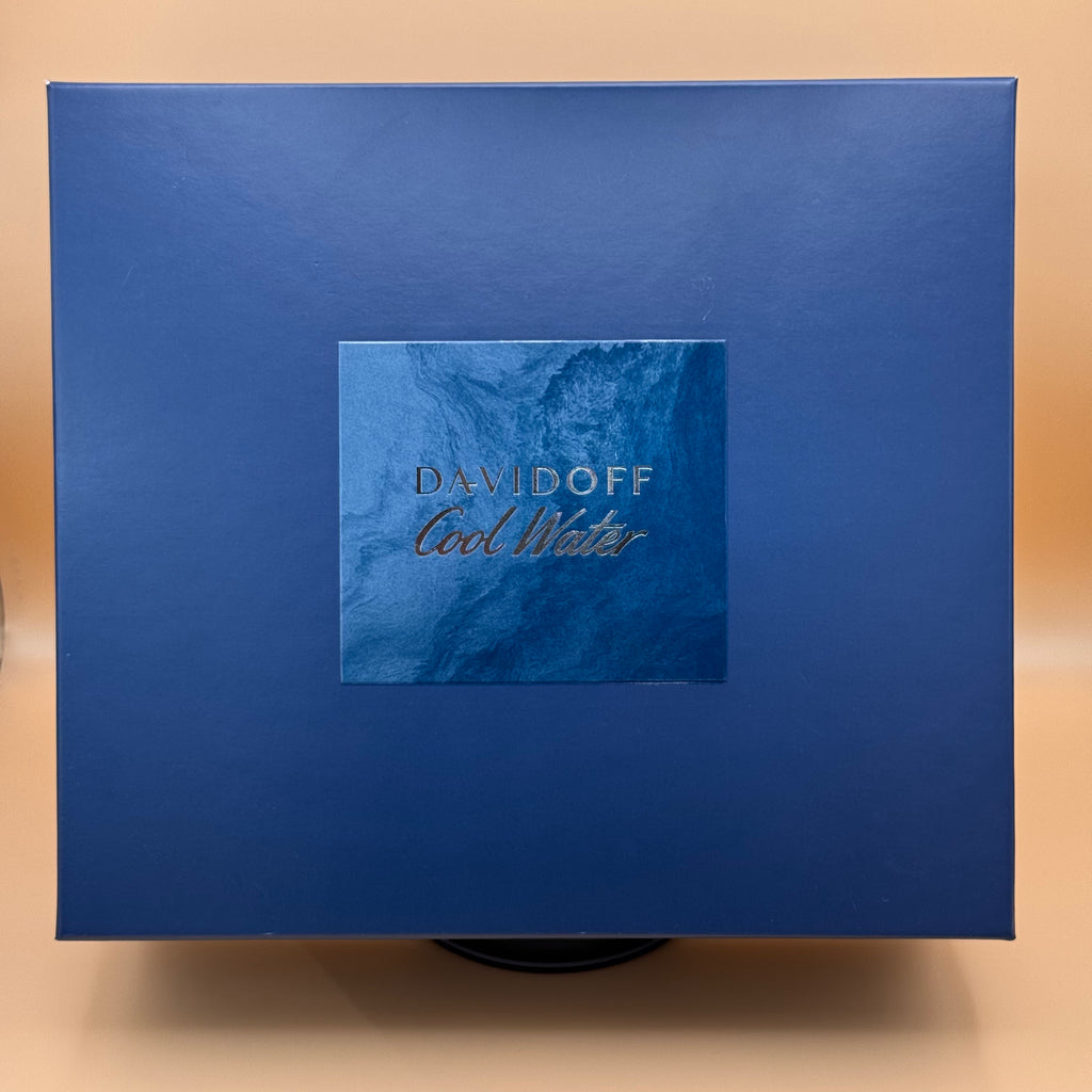 Blue Davidoff Cool Water packaging on a beige background