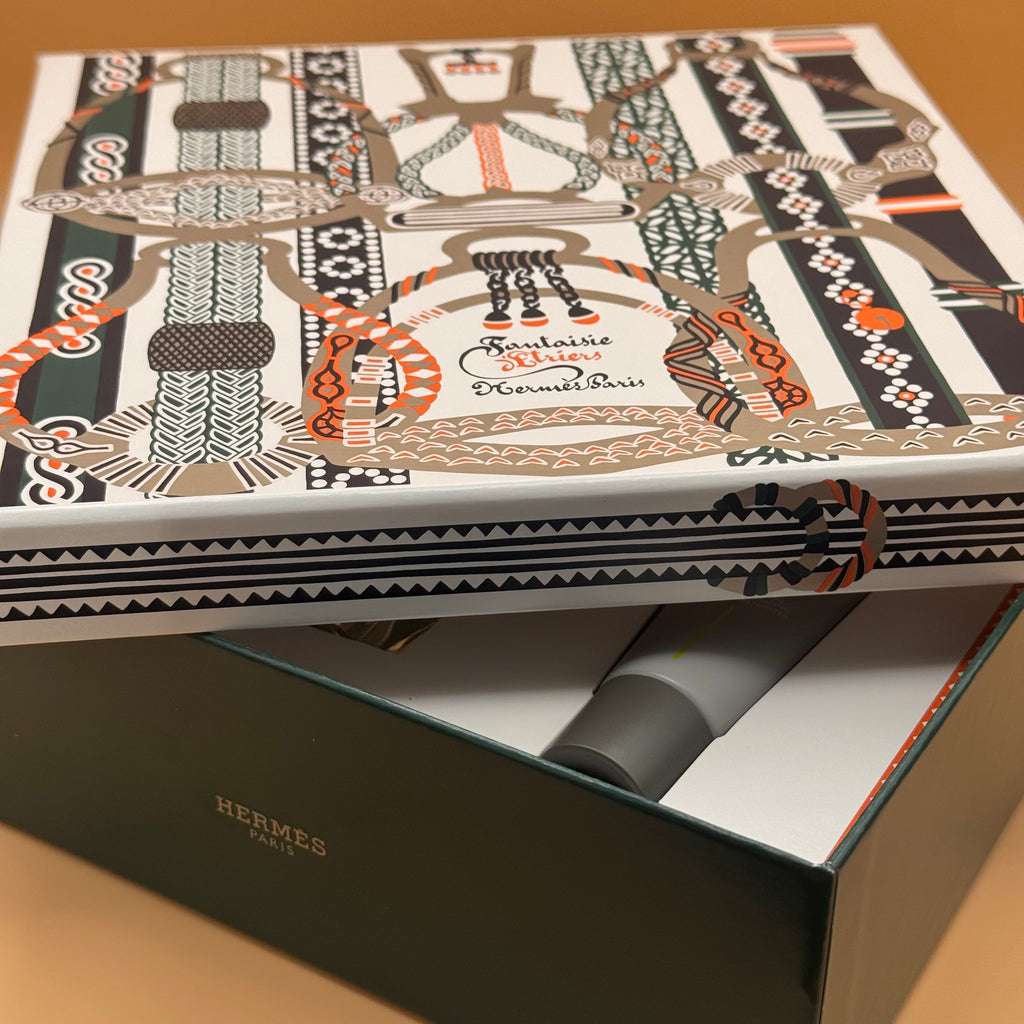 H24 Hermes decorative box with intricate patterns and branding on a wooden surface