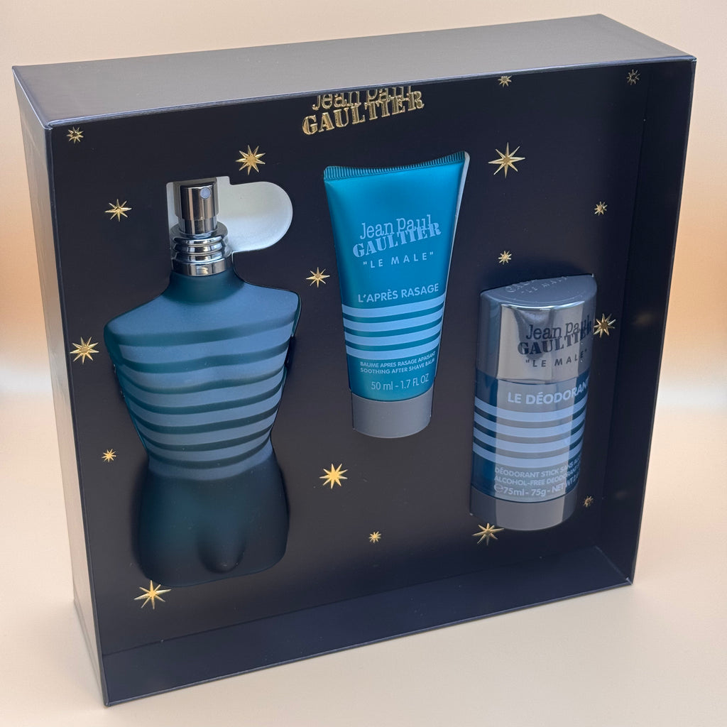Jean Paul Gaultier perfume set with a blue bottle and two smaller containers in a decorative box.
