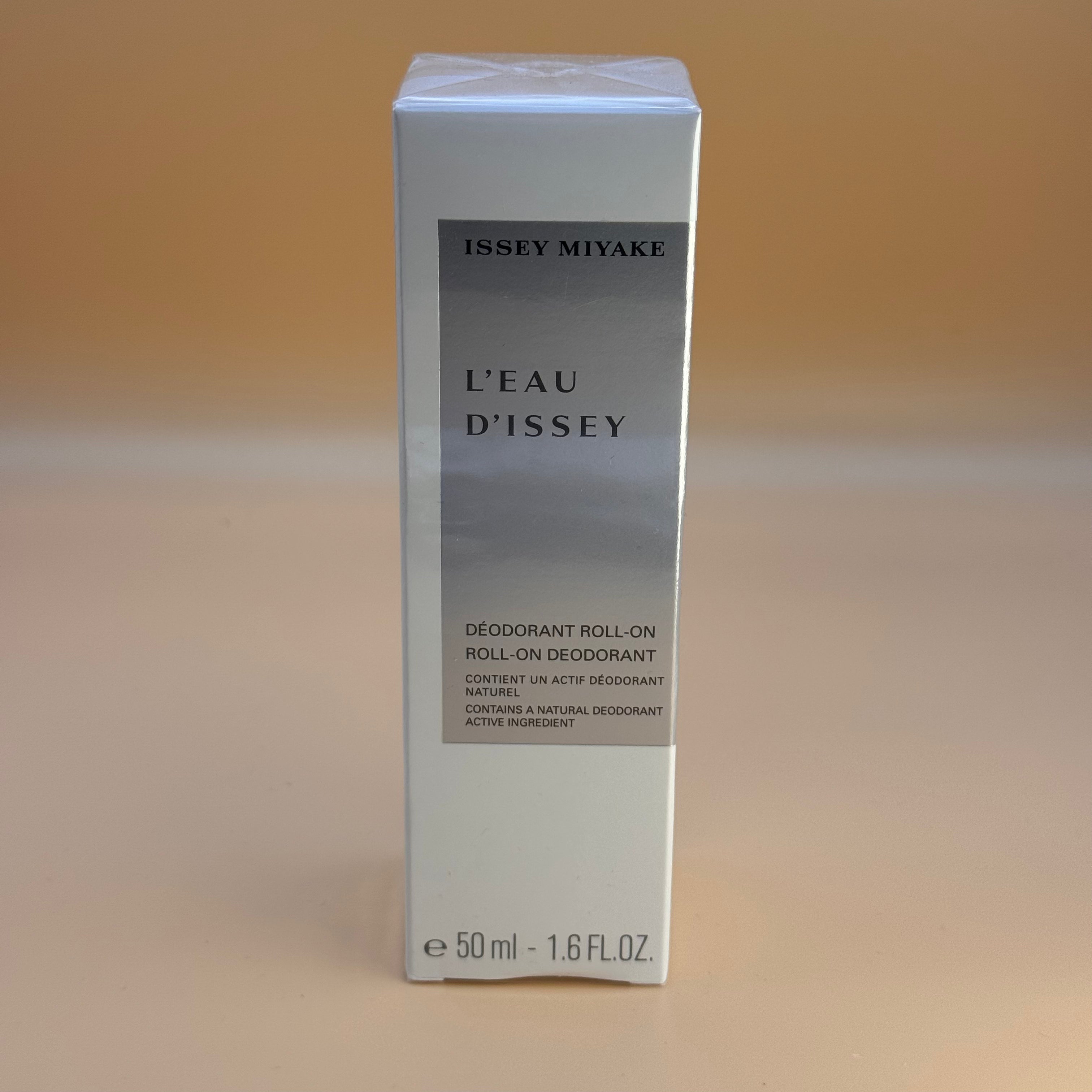 Issey Miyake L'Eau D'Issey deodorant roll-on packaging on a beige background