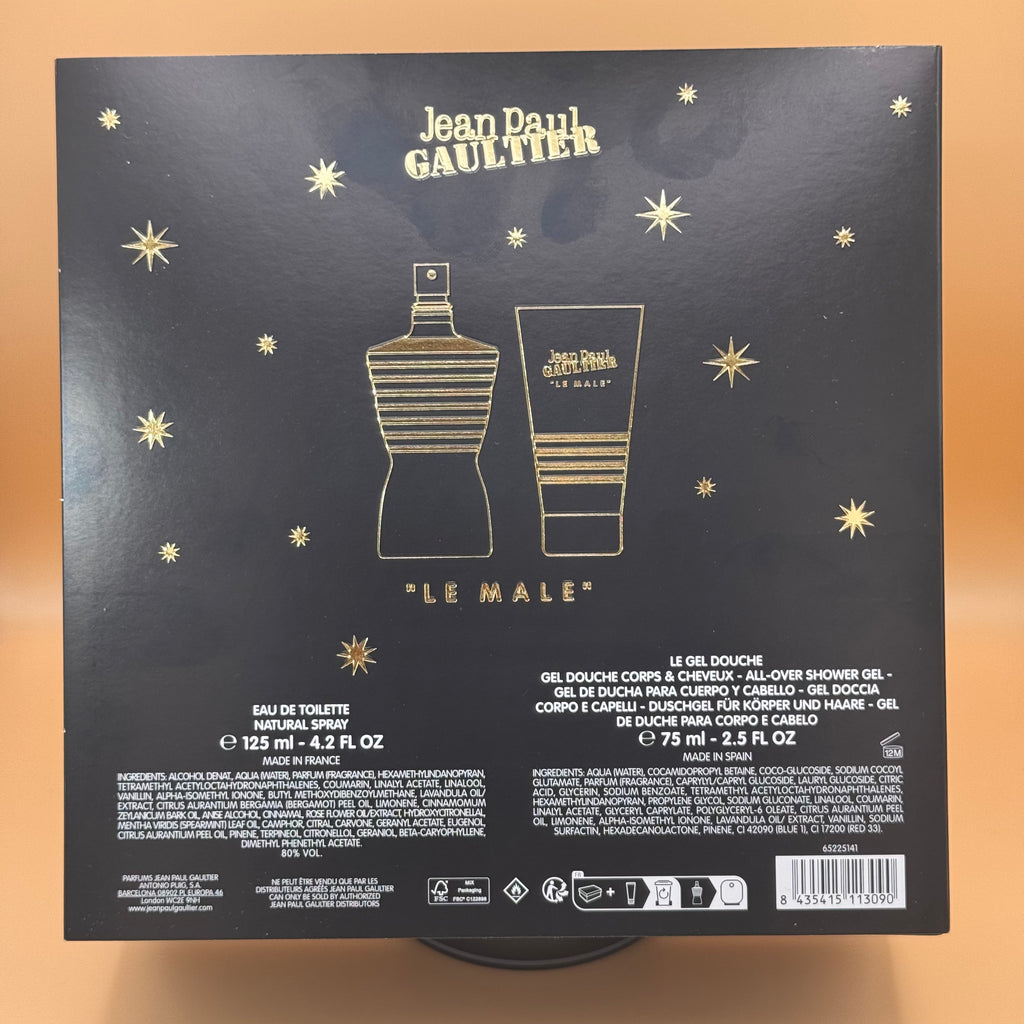 Back of a Jean Paul Gaultier 'Le Male' product packaging with star designs on a beige background.