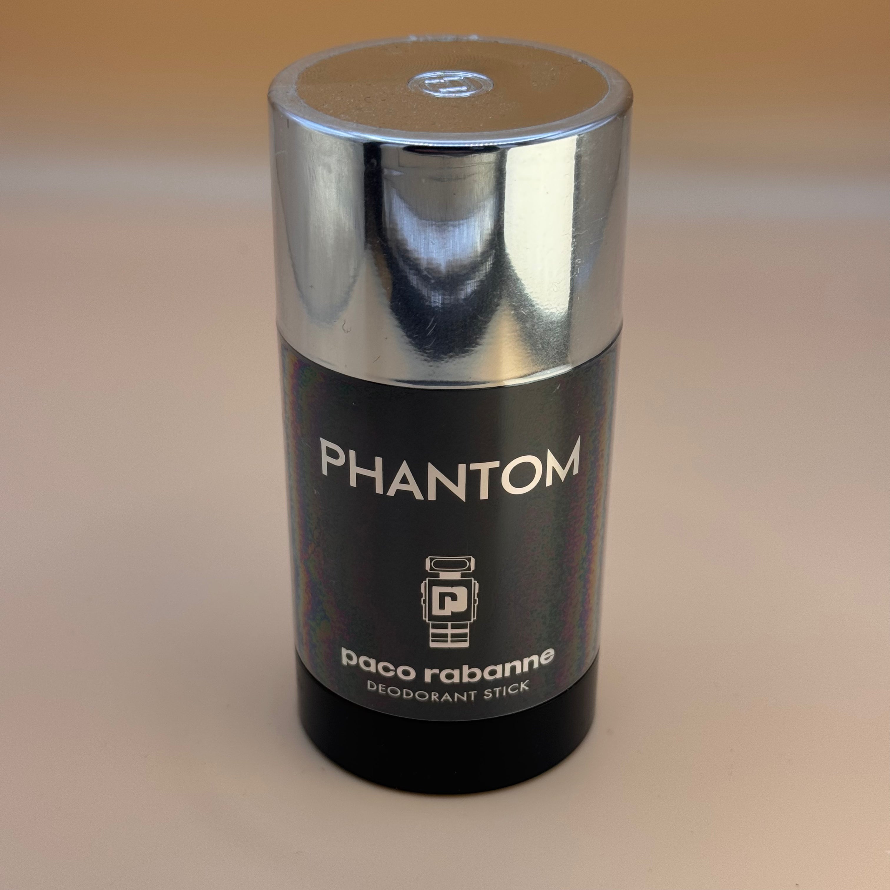 Paco Rabanne Phantom deodorant stick on a beige background