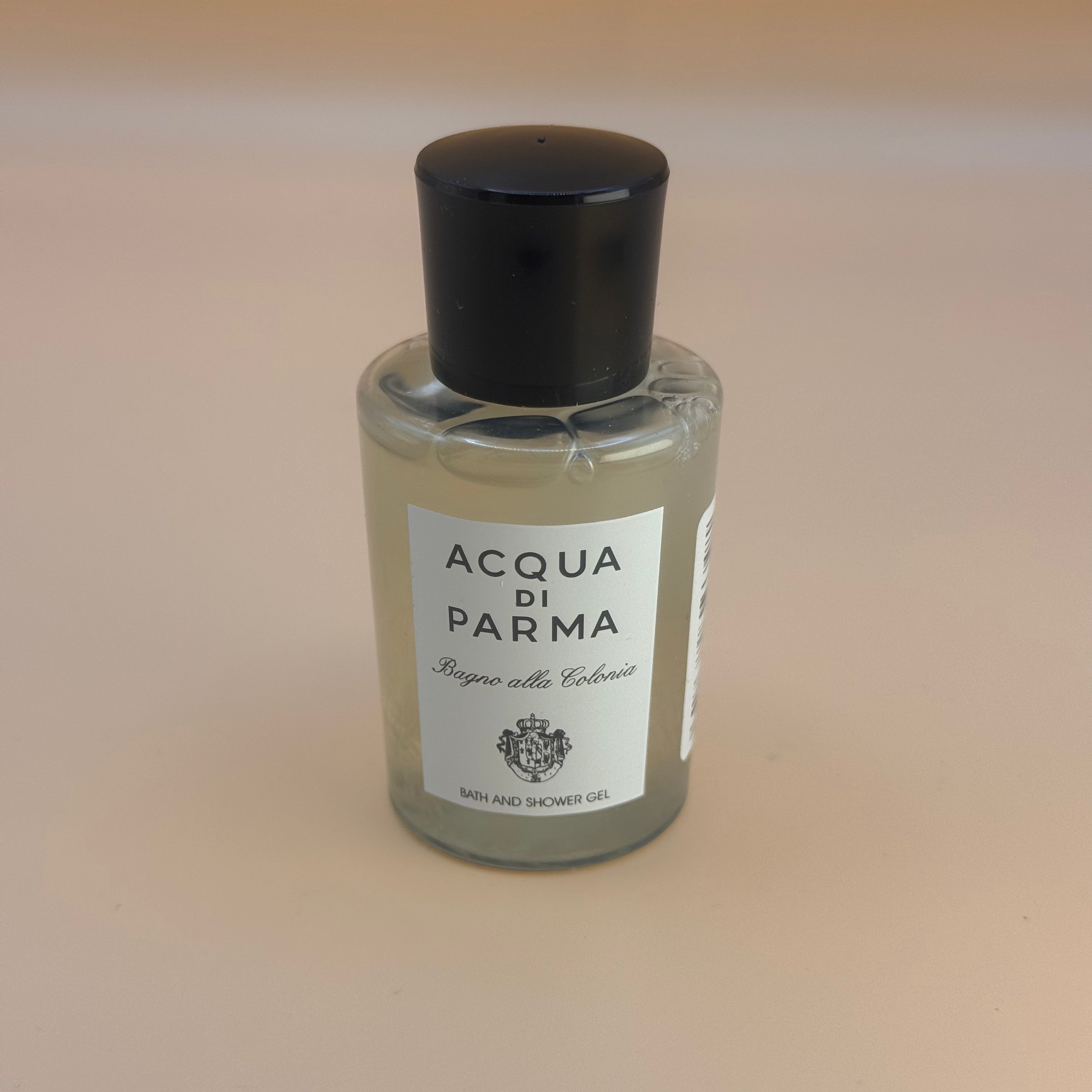 Acqua di Parma Bath and shower gel bottle on a beige background