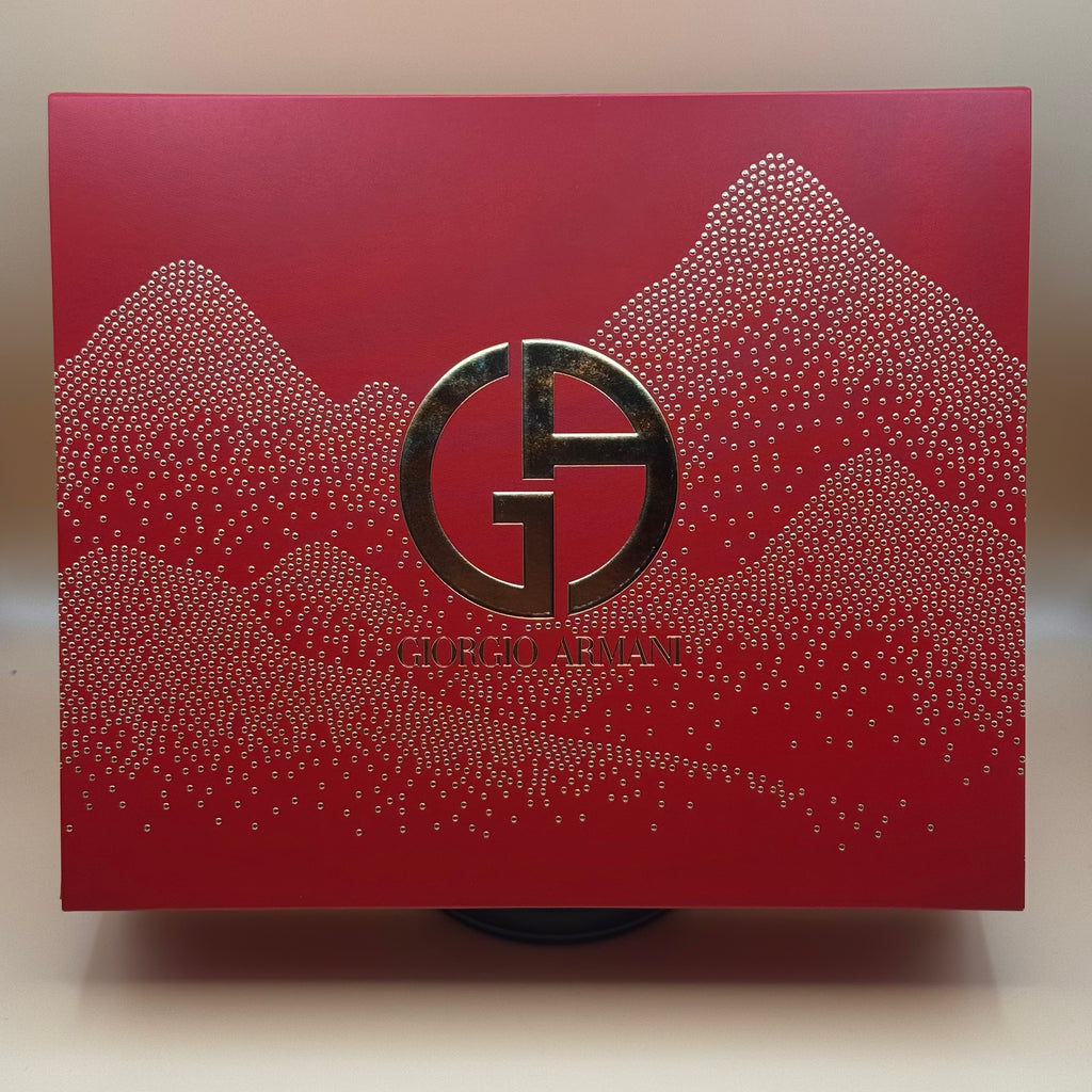Red Giorgio Armani product packaging with gold logo and text.