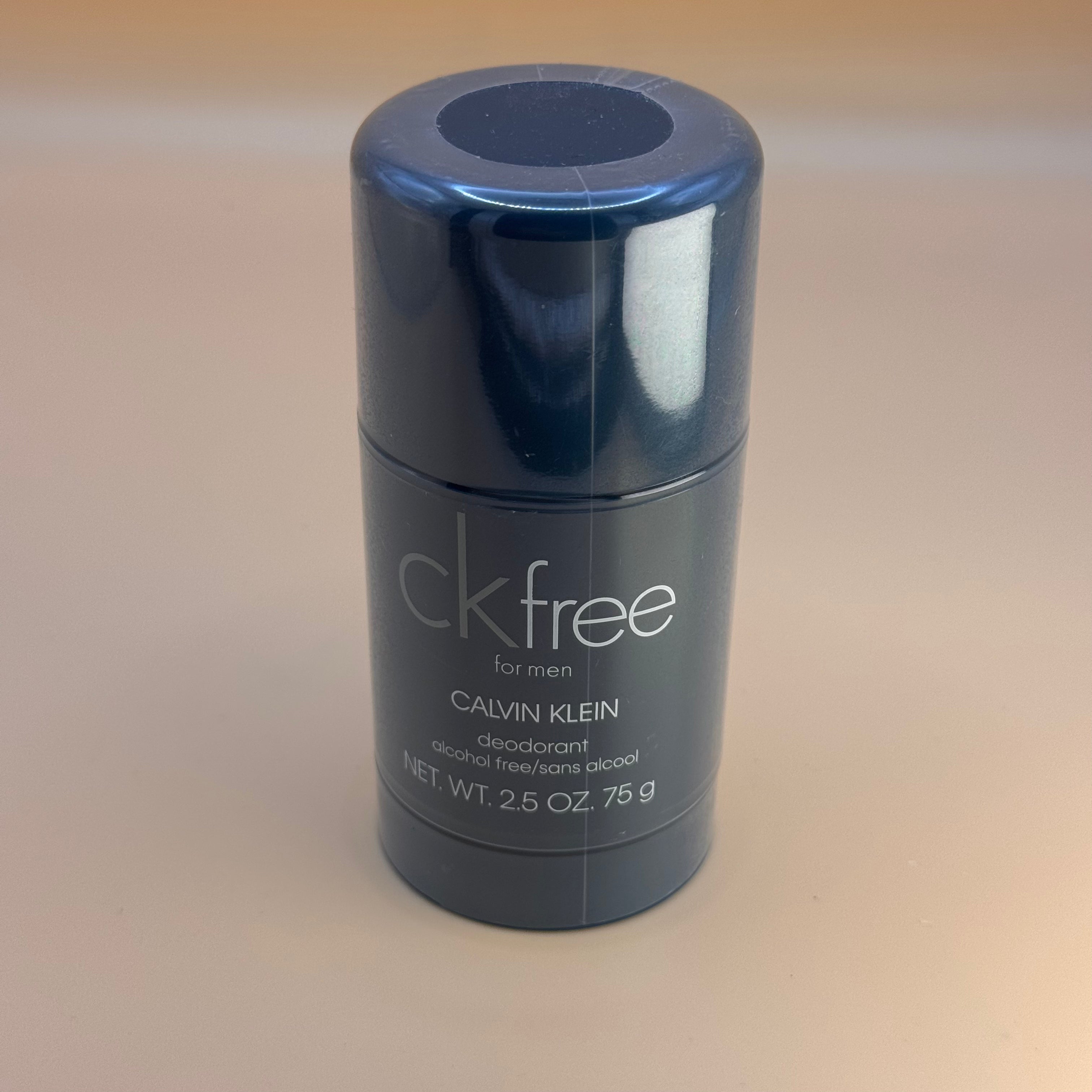 Calvin Klein deodorant stick on a beige background